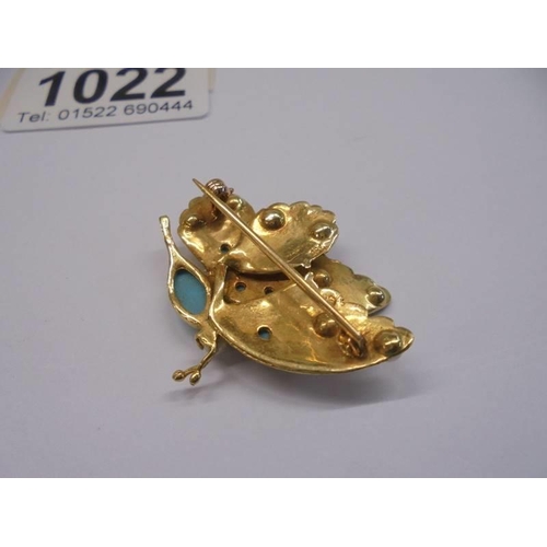 1022 - A gold butterfly brooch set seed pearls and turquoise (tests as 18ct), 6.69 grams.