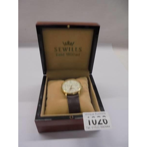 1026 - A cased 9ct gold Sewills Millenium limited edition wrist watch, in working order, In used condition,... 