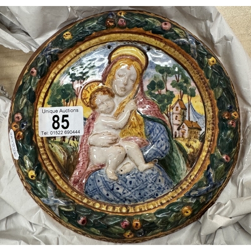 85 - An early majolica plate depicting Mary and Infant Jesus. In bright colours.