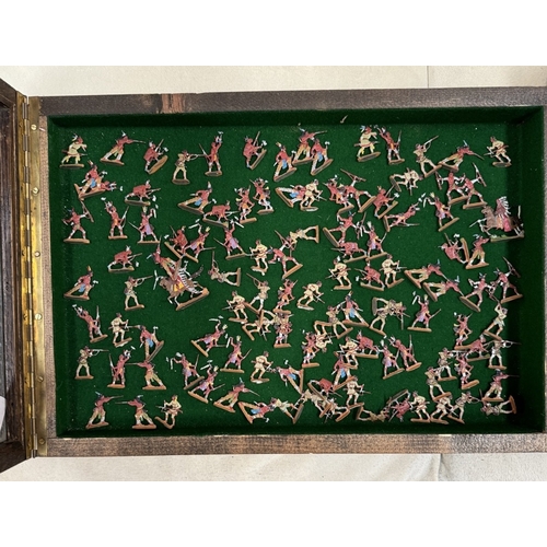 95 - A cased collection of hand painted lead soldiers. The soldiers include Native American chiefs, soldi... 