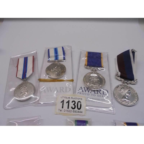 1130 - Four large and three miniature commemorative medals for Queen Elizabeth II.