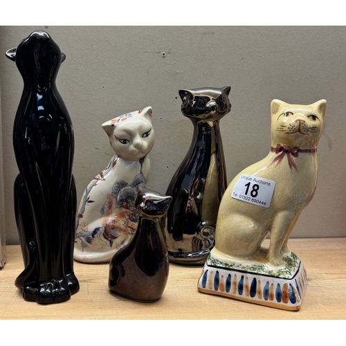 18 - A selection of pottery cat ornaments