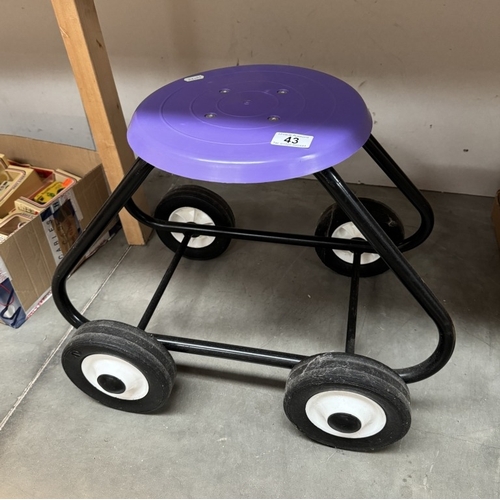 43 - A gardening stool on wheels