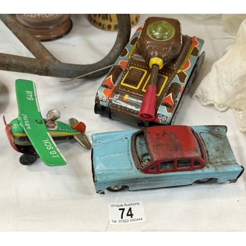 74 - A West German tinplate clockwork plane, friction tank and car