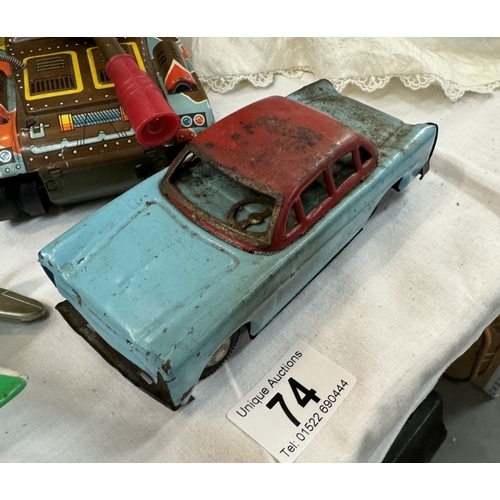 74 - A West German tinplate clockwork plane, friction tank and car