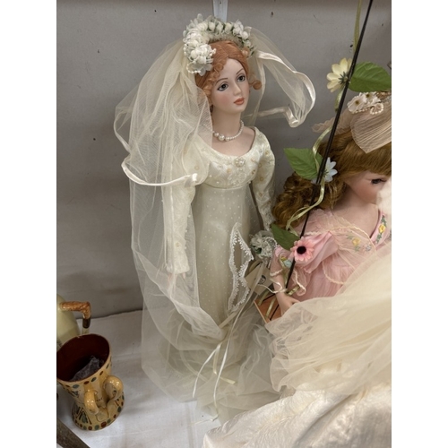 76 - 4 porcelain dolls, including 1 on a swing