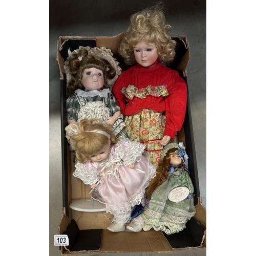 103 - A box of porcelain dolls