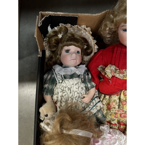 103 - A box of porcelain dolls