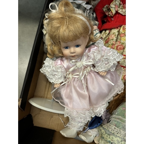 103 - A box of porcelain dolls