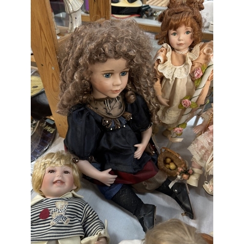 119 - A quantity of bisque head collectors dolls