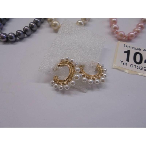 1048 - Three coloured pearl necklaces and a pair of pearl earrings.