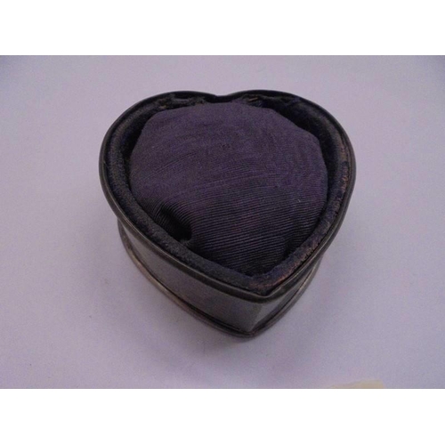 1053 - A silver heart shaped pin cushion.