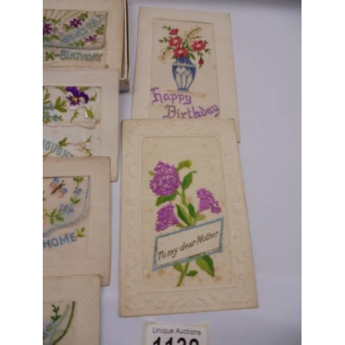 1138 - Eight early 20th century silk greeting cards and a Jerusalem souvenier booklet with dried flowers.