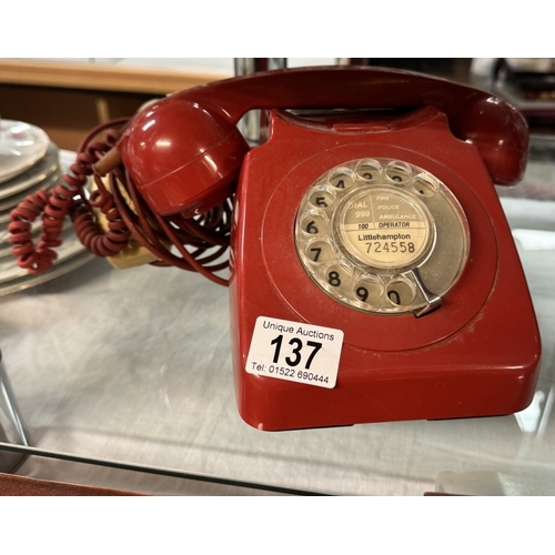 137 - A vintage red dial telephone