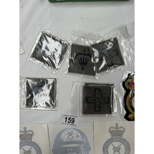 159 - A quantity of cloth badges and patches etc.,