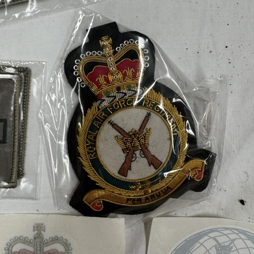 159 - A quantity of cloth badges and patches etc.,