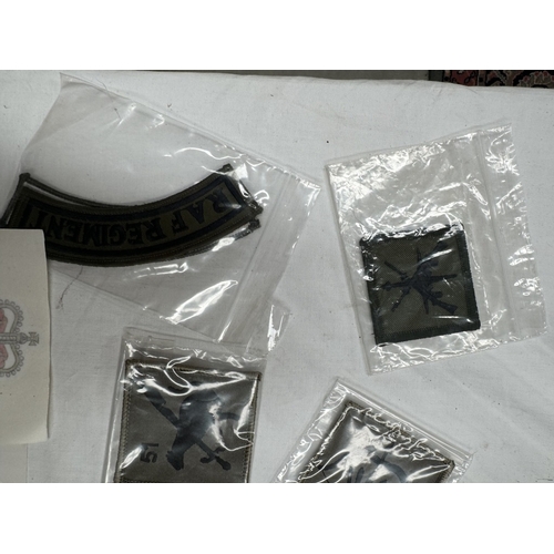 159 - A quantity of cloth badges and patches etc.,