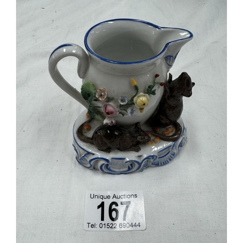 167 - A continental porcelain ornament of Mice & A milk jug