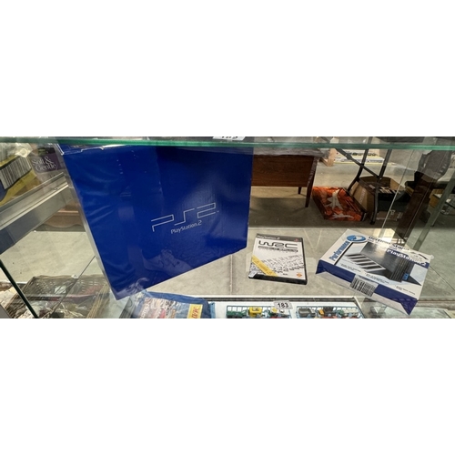 183 - A boxed PlayStation 2 with WRC game & vertical stand