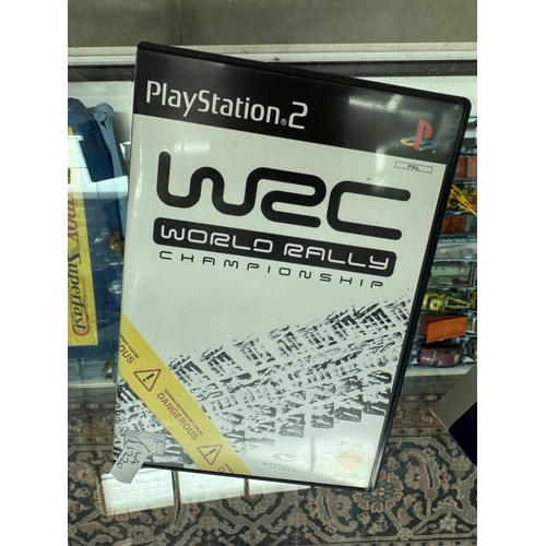 183 - A boxed PlayStation 2 with WRC game & vertical stand