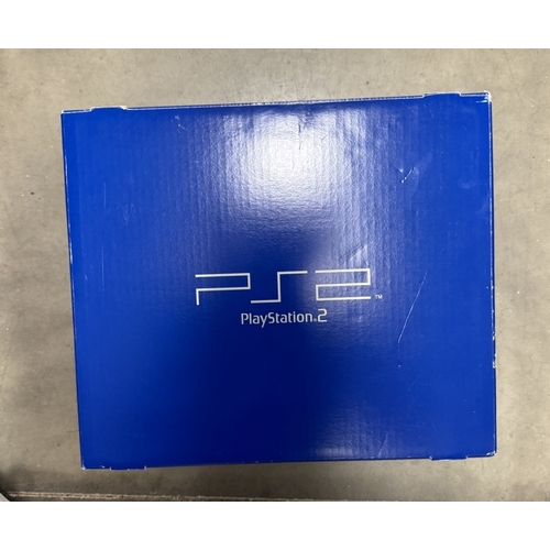 183 - A boxed PlayStation 2 with WRC game & vertical stand