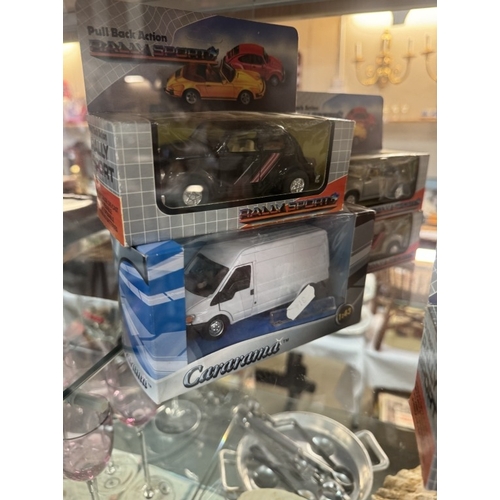 197 - A quantity of boxed rally cars etc