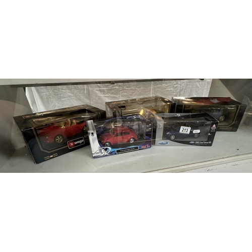 213 - Three Burago 1/18 scale cars & 2 others