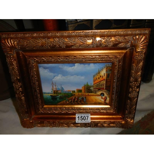 1507 - A gilt framed overpainted print of a continental scene.