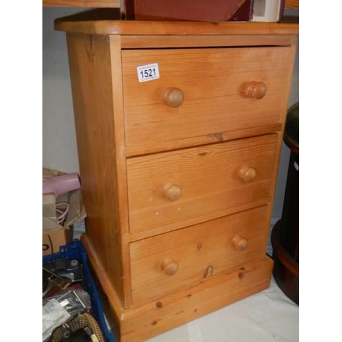 1521 - A pine three drawer bedside chest. COLLECT ONLY.