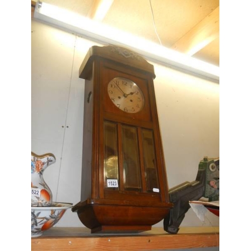 1523 - An oak wall clock, in working order. COLLECT ONLY.