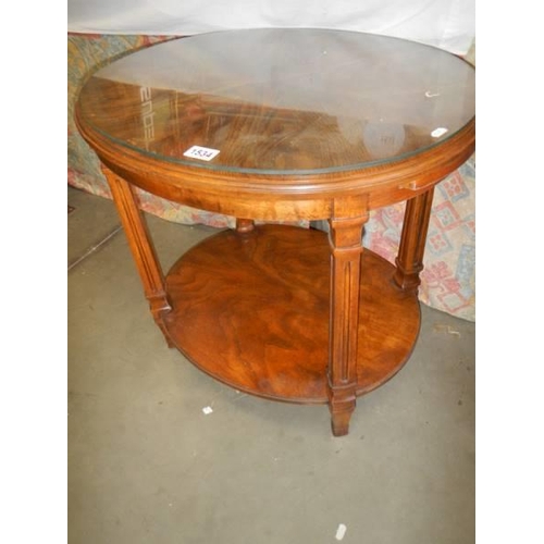 1534 - An oval oak occasional table with glass top. COLLECT ONLY.