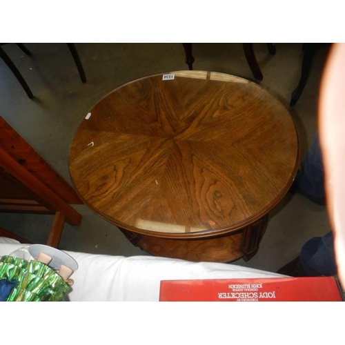 1534 - An oval oak occasional table with glass top. COLLECT ONLY.