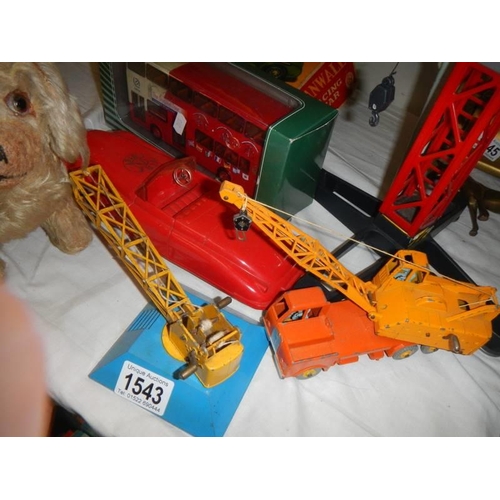 1543 - A toy crane and other toys.