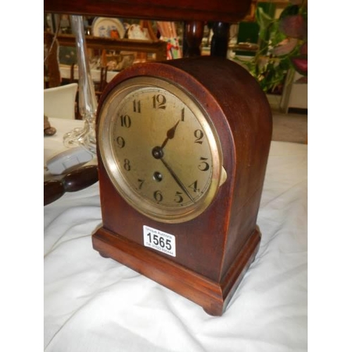 1565 - A domed top mantel clock. In working order.