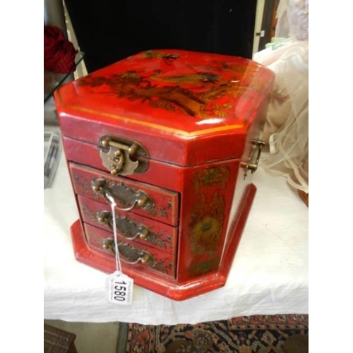 1580 - A good quality red lacquered jewellery casket.