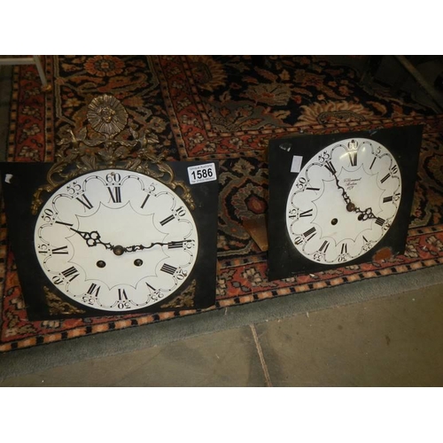 1586 - Two old wall clock movements.