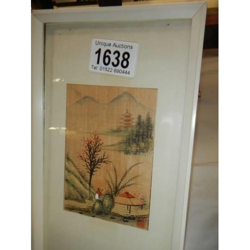 1638 - Two small framed and glazed oriental pictures.