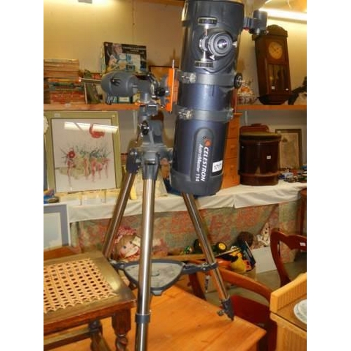 1717 - A Celestron Astromaster 114 telescope on tripod, COLLECT ONLY.