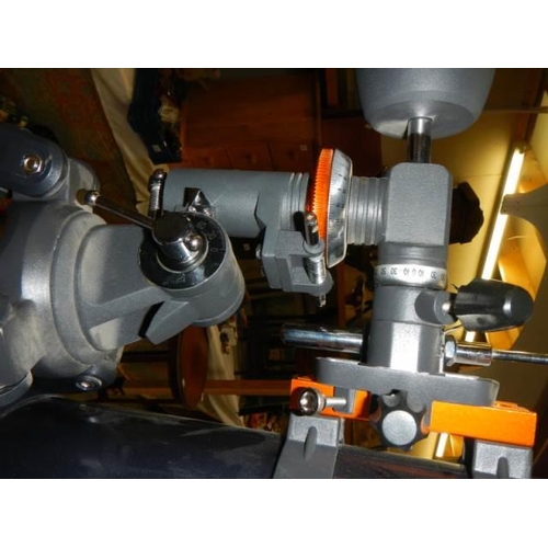 1717 - A Celestron Astromaster 114 telescope on tripod, COLLECT ONLY.