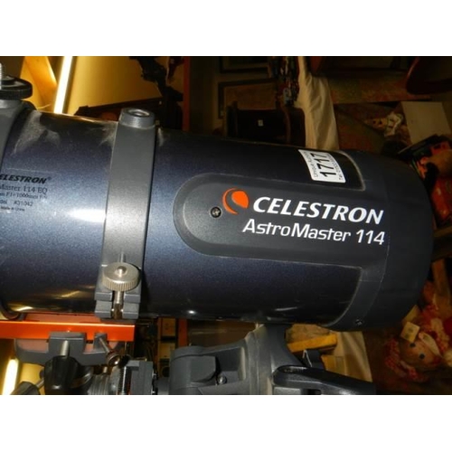 1717 - A Celestron Astromaster 114 telescope on tripod, COLLECT ONLY.