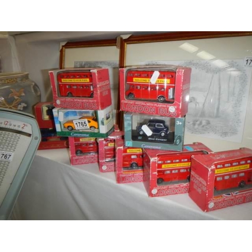 1765 - A quantity of boxed diecast buses etc