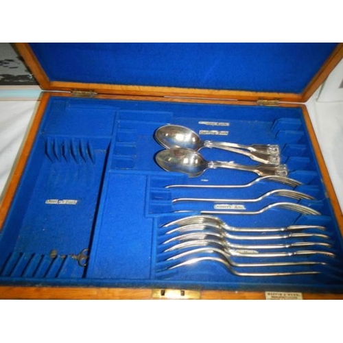 1778 - A cutlery box with some cutlery and 1 other box