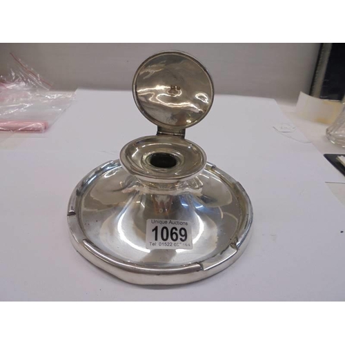 1069 - A large silver inkwell.