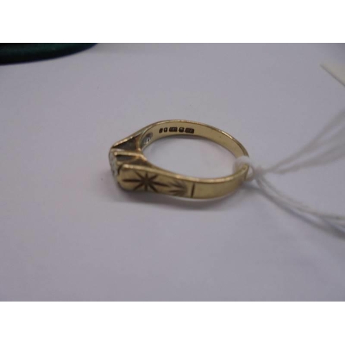 1074 - A 9ct gold ring set diamond chip, size J, 2.1 grams.