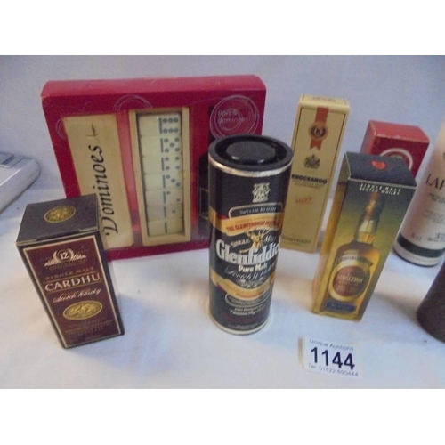 1144 - Nine boxed whisky miniatures and a port gift set.