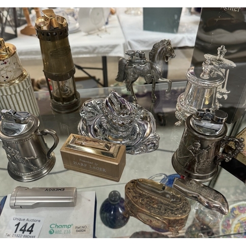 144 - A collection of ornate vintage lighters