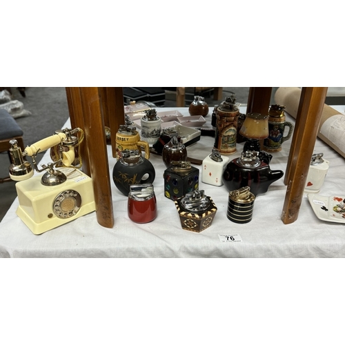 76 - A collection of vintage novelty table lighters