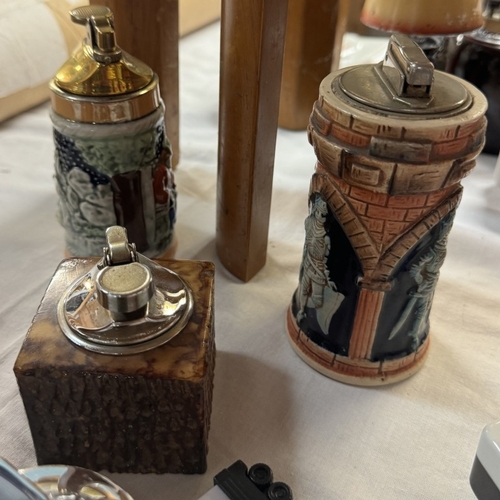 76 - A collection of vintage novelty table lighters