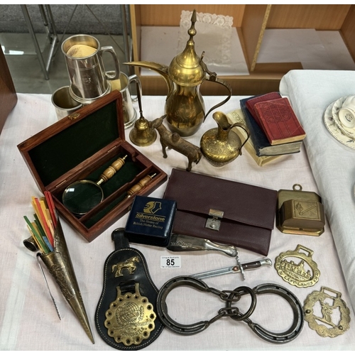 85 - A mixed lot including brass match striker, cased magnifying glass, silver plate tankards etc