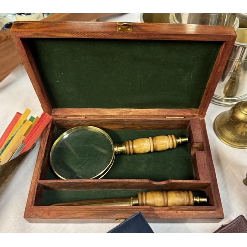 85 - A mixed lot including brass match striker, cased magnifying glass, silver plate tankards etc